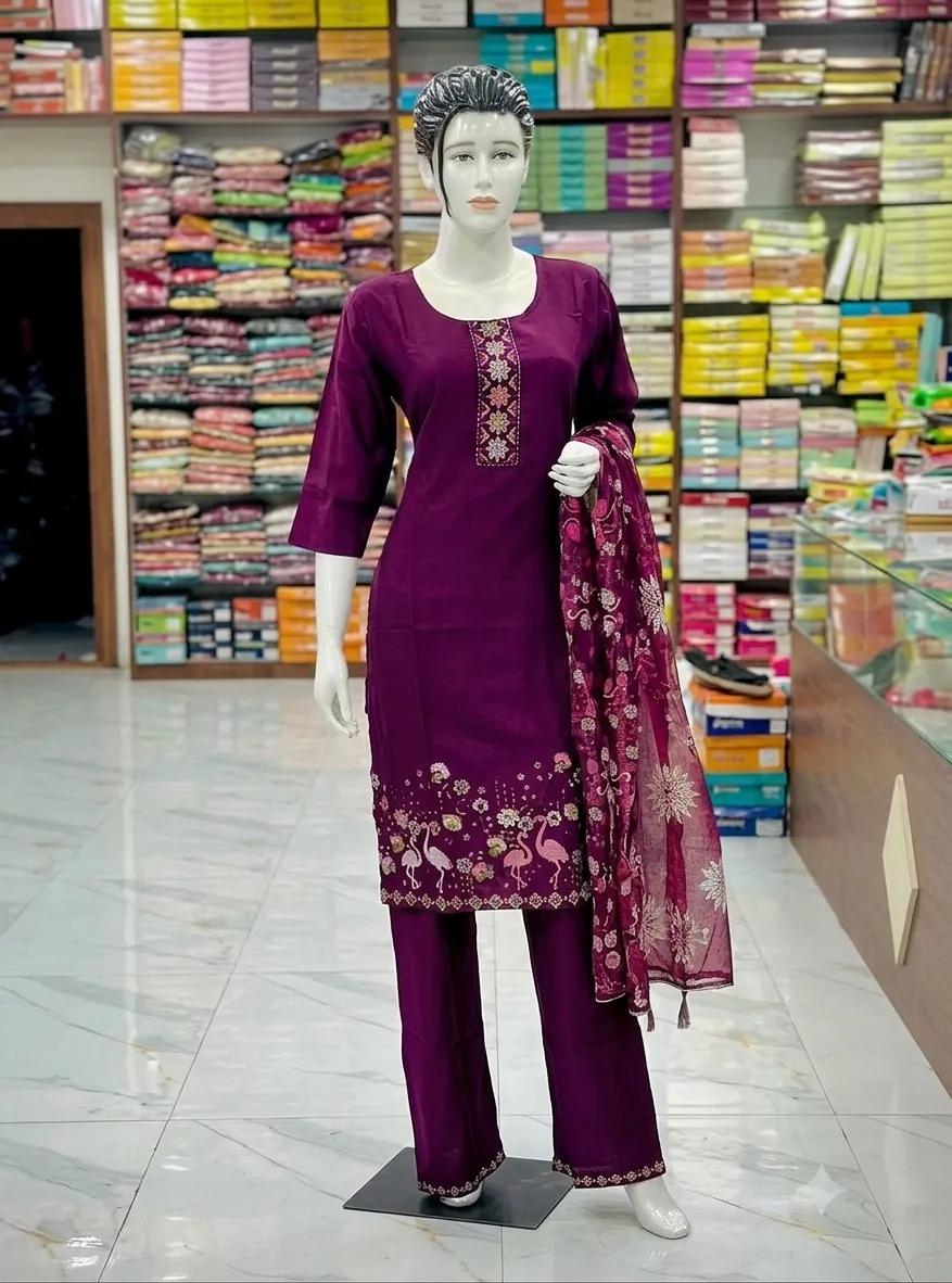 Wine kurti set with flamingo embroidery on the hem and a net dupatta